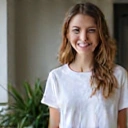 Happy client Jessica L. smiling, looking confident after achieving her weight loss goals.